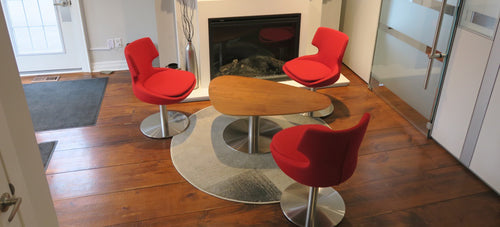 Tango Island Coffee Table by SohoConcept, showing island coffee table with chairs in live shot.