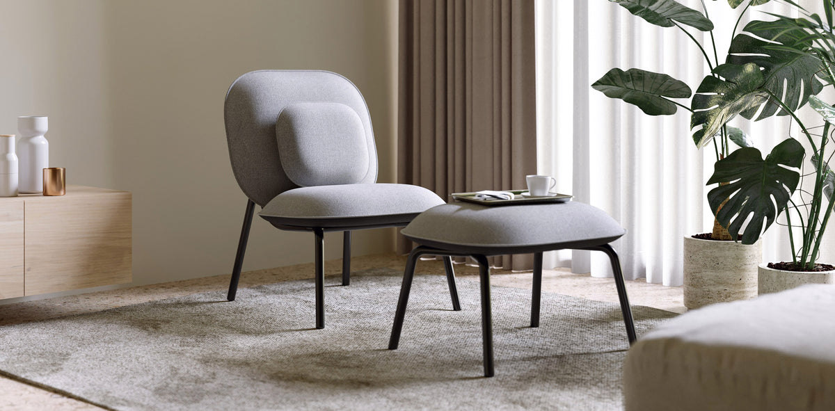 Tasca Ottoman by Toou, showing tasca ottoman with chair in live shot.