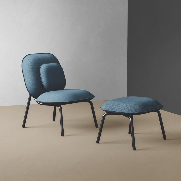 Tasca Ottoman by Toou, showing tasca ottoman with chair in live shot.