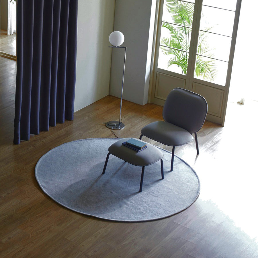 Tasca Ottoman by Toou, showing tasca ottoman with chair in live shot.