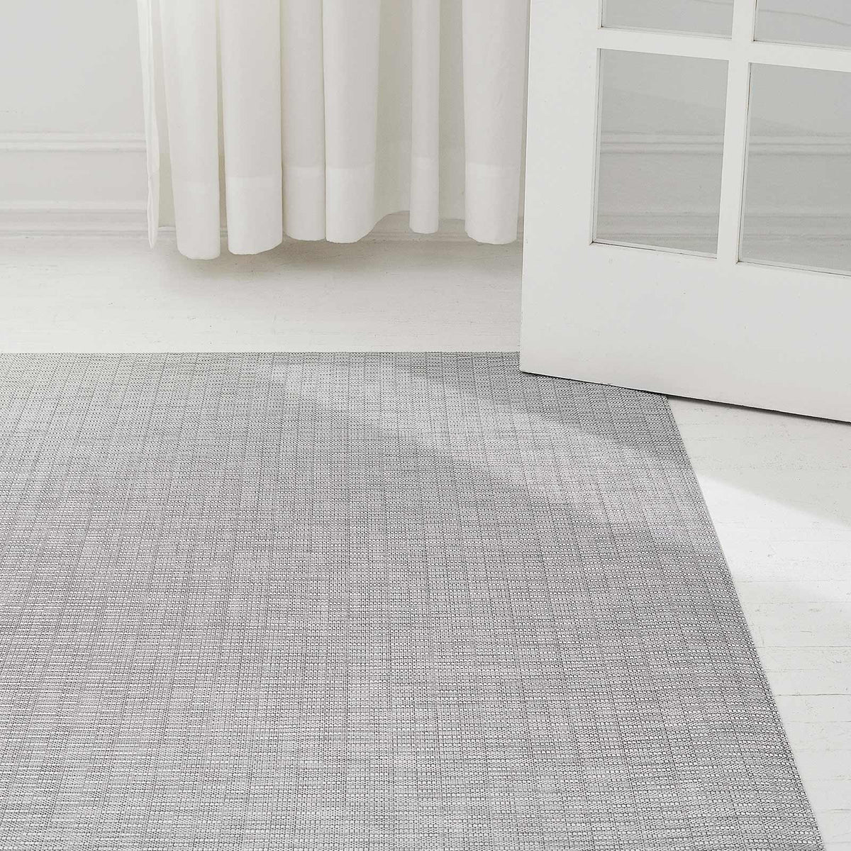 Thatch Woven Floor Mat by Chilewich, showing thatch woven floor mat in live shot.