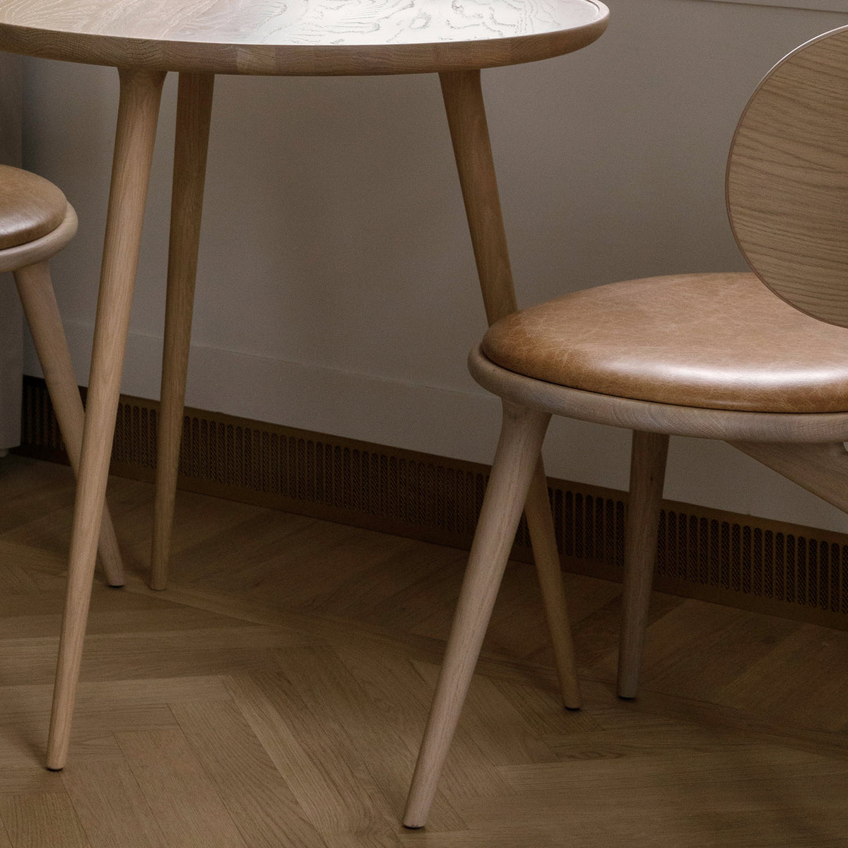 The Lounge Chair by Mater, showing closeup view of the lounge chair with table in live shot.