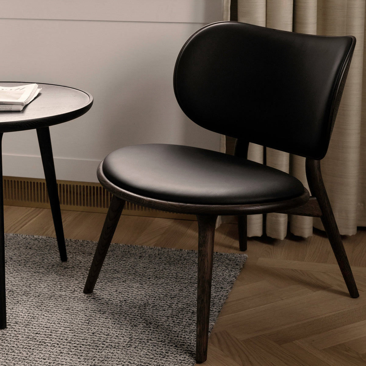 The Lounge Chair by Mater, showing the lounge chair with table in live shot.