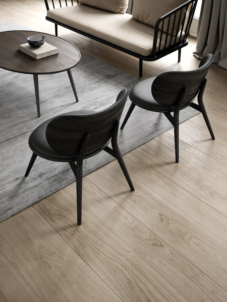 The Lounge Chair by Mater, showing the lounge chairs with table & sofa in live shot.