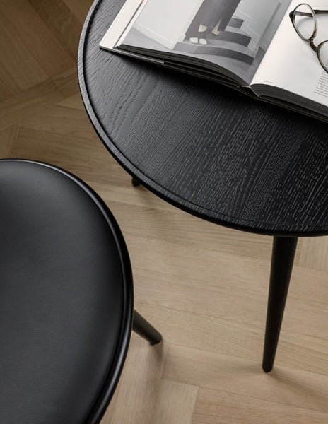 The Lounge Chair by Mater, showing closeup view of the lounge chair with table in live shot.