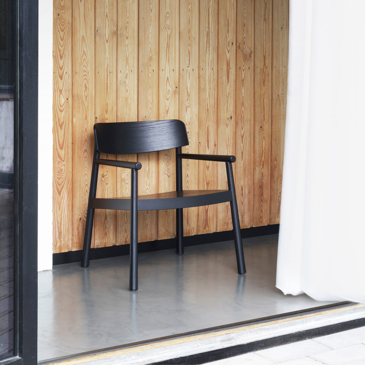 Timb Lounge Armchair by Normann Copenhagen, showing timb lounge armchair in live shot.