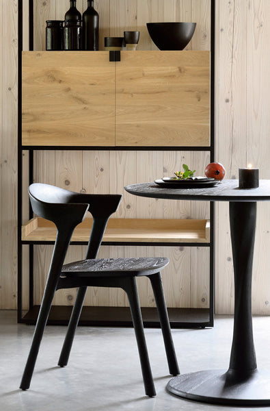 Torsion Dining Table by Ethnicraft, showing closeup view of torsion dining table in live shot.