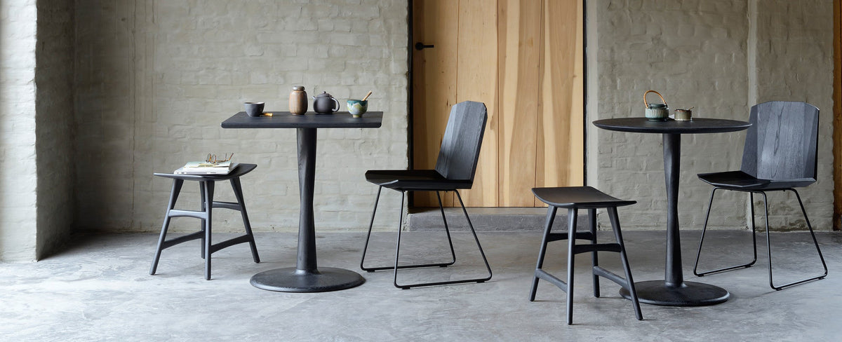 Torsion Dining Table by Ethnicraft, showing torsion dining tables in live shot.