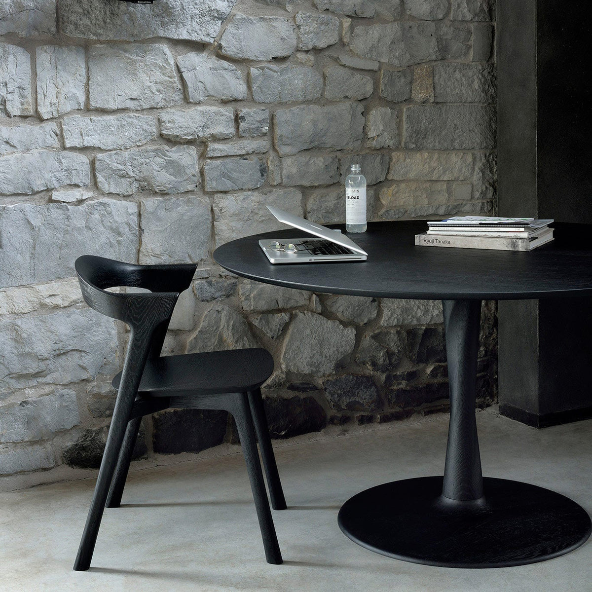 Torsion Dining Table by Ethnicraft, showing closeup view of torsion dining table in live shot.