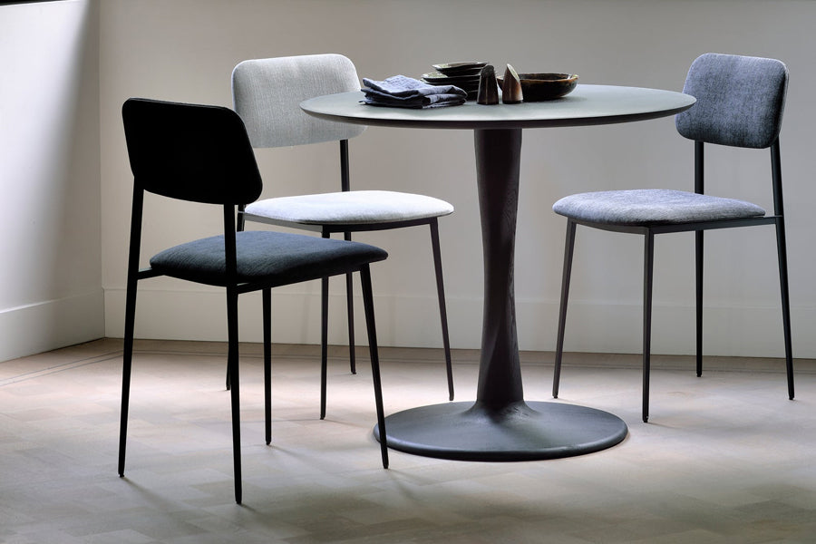 Torsion Dining Table by Ethnicraft, showing torsion dining table in live shot.