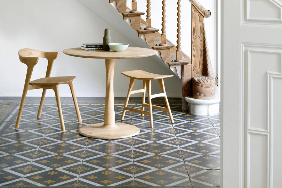 Torsion Dining Table by Ethnicraft, showing torsion dining table in live shot.