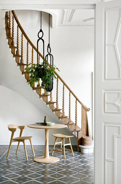 Torsion Dining Table by Ethnicraft, showing torsion dining table in live shot.
