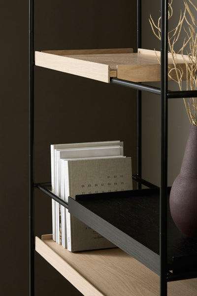 Tray Shelf by Woud, showing closeup view of tray shelf in live shot.