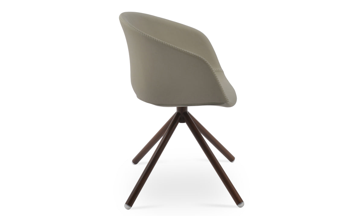 Tribeca Stick Swivel Armchair by SohoConcept, showing side view of stick swivel arm chair.