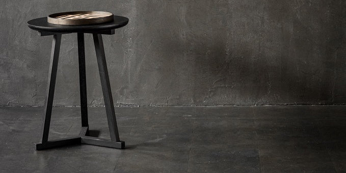 Tripod Side Table by Ethnicraft, showing tripod side table in live shot.