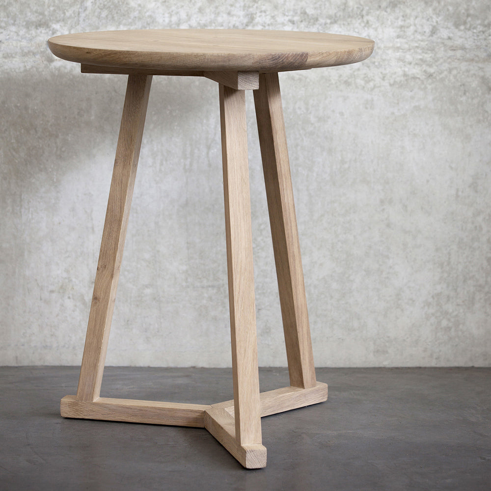 Tripod Side Table by Ethnicraft, showing tripod side table in live shot.