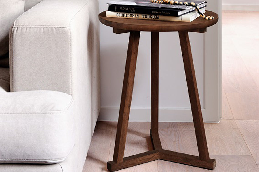 Tripod Side Table by Ethnicraft, showing tripod side table in live shot.