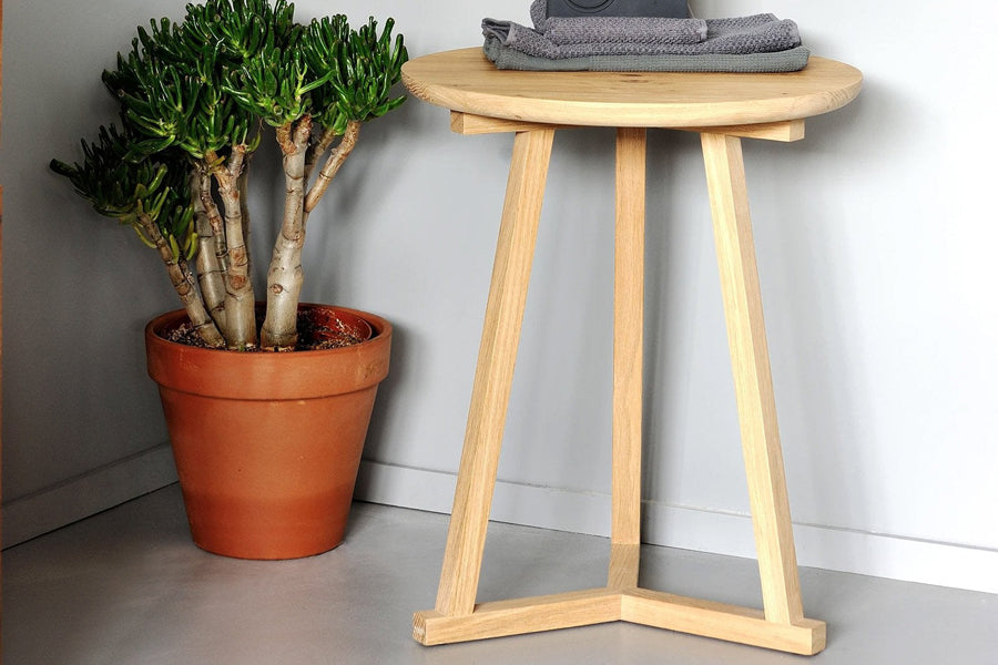 Tripod Side Table by Ethnicraft, showing tripod side table in live shot.