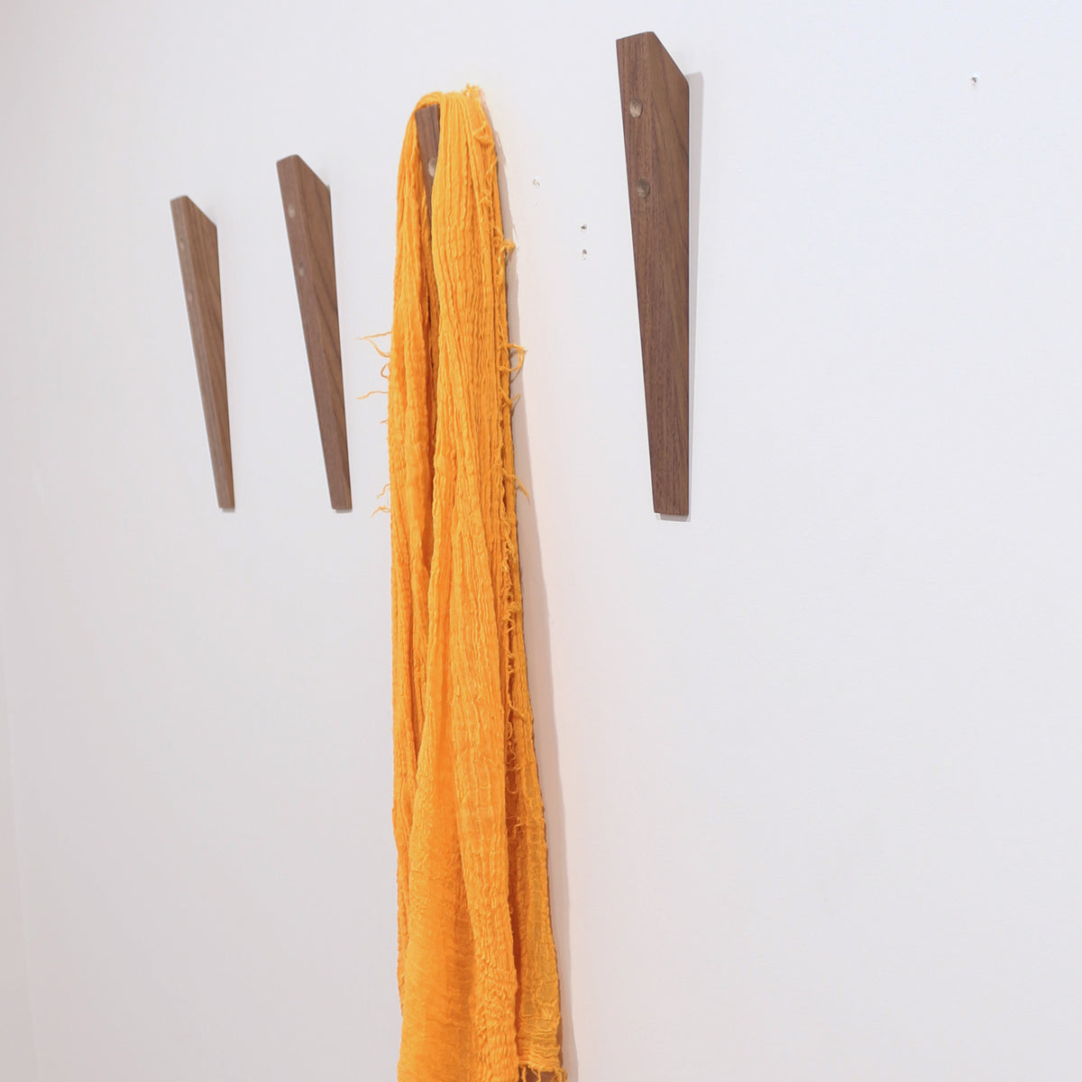 Book Hook by Tronk Design, showing book hook in live shot.