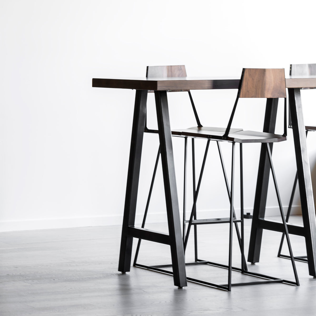 Clarkester Stool by Tronk Design, showing clarkester stools in live shot.