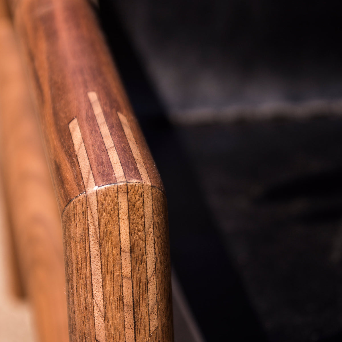 Gallagher Lounge Chair by Tronk Design, showing detail view of arms of gallagher lounge chair.