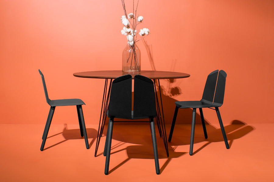 Noa Chair by Tronk Design, showing noa chairs in live shot.