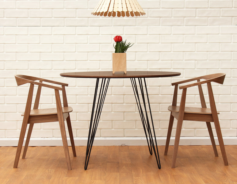 Williams Round Dining Table by Tronk Design, showing williams round dining table in live shot.
