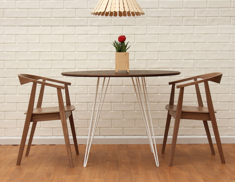 Williams Round Dining Table by Tronk Design, showing williams round dining table in live shot.
