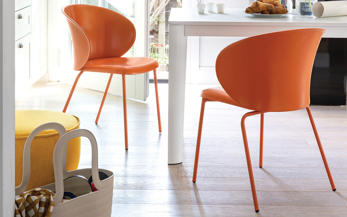 Tuka Metal Legs Armchair by Connubia, showing tuka metal legs armchairs in live shot.