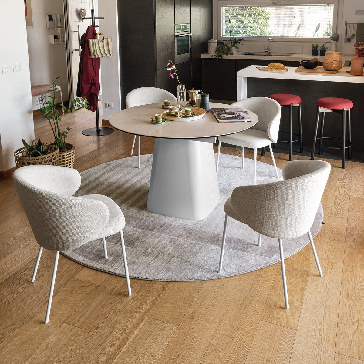 Tuka Metal Legs Armchair by Connubia, showing tuka metal legs armchairs in live shot.