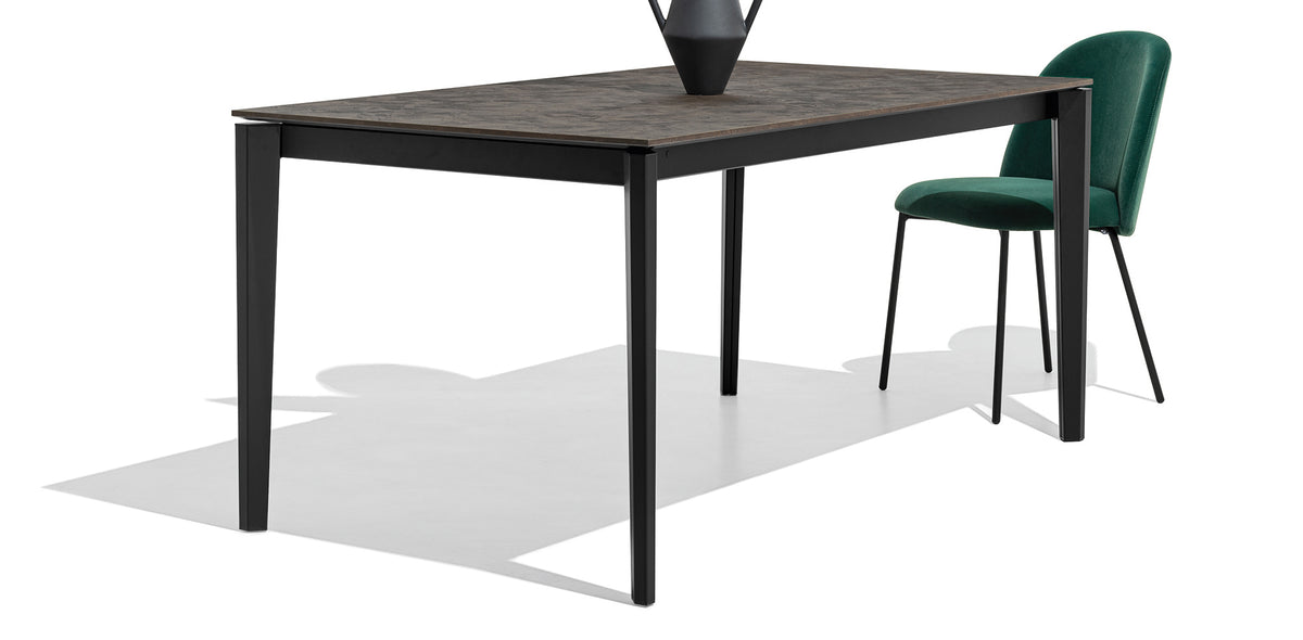 Tuka Metal Legs Chair by Connubia, showing angle view of tuka metal legs chair in matt black metal frame.