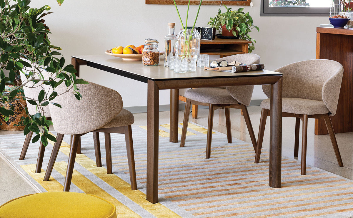 Tuka Wood Legs Armchair by Connubia, showing tuka wood legs armchairs in live shot.