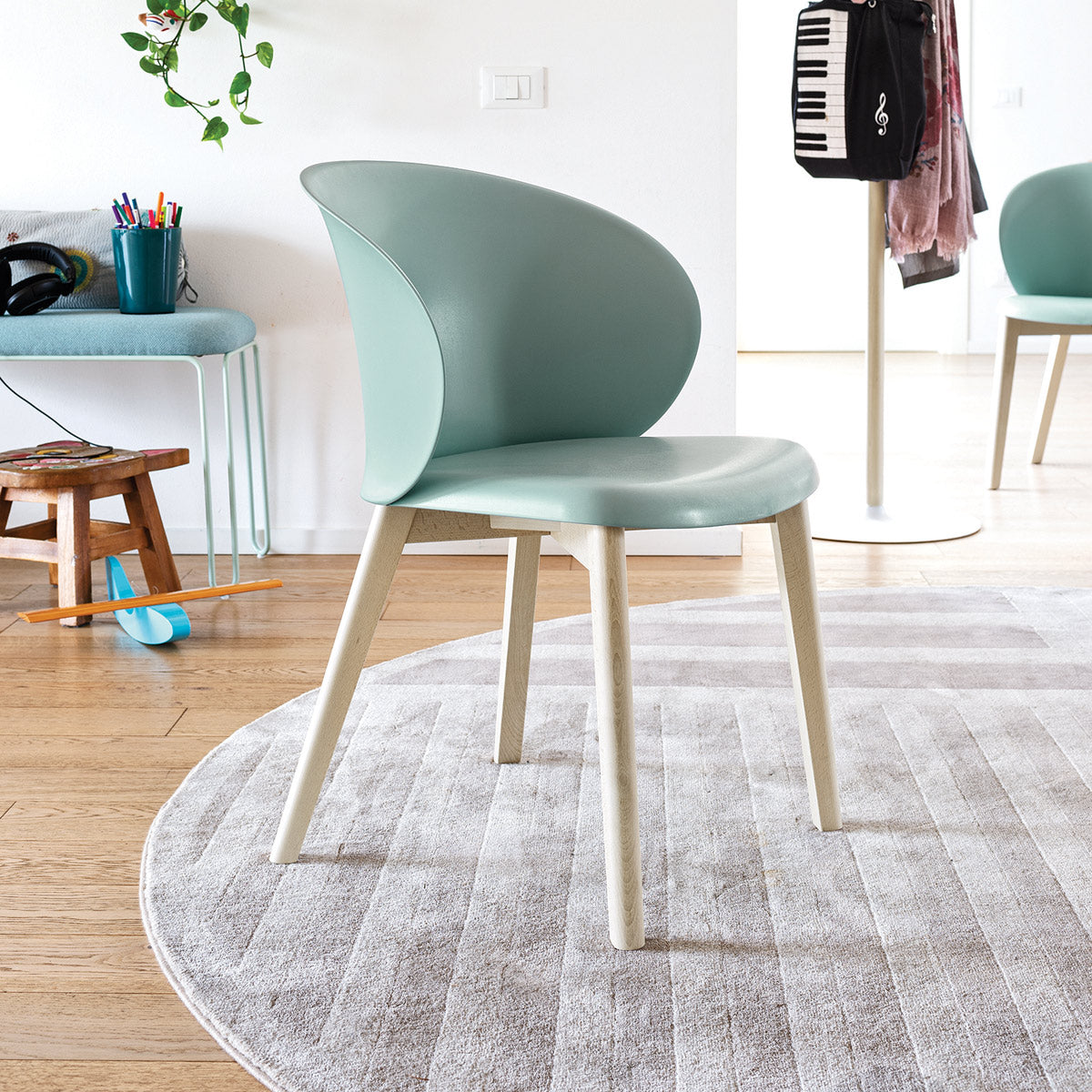 Tuka Wood Legs Armchair by Connubia, showing tuka wood legs armchairs in live shot.
