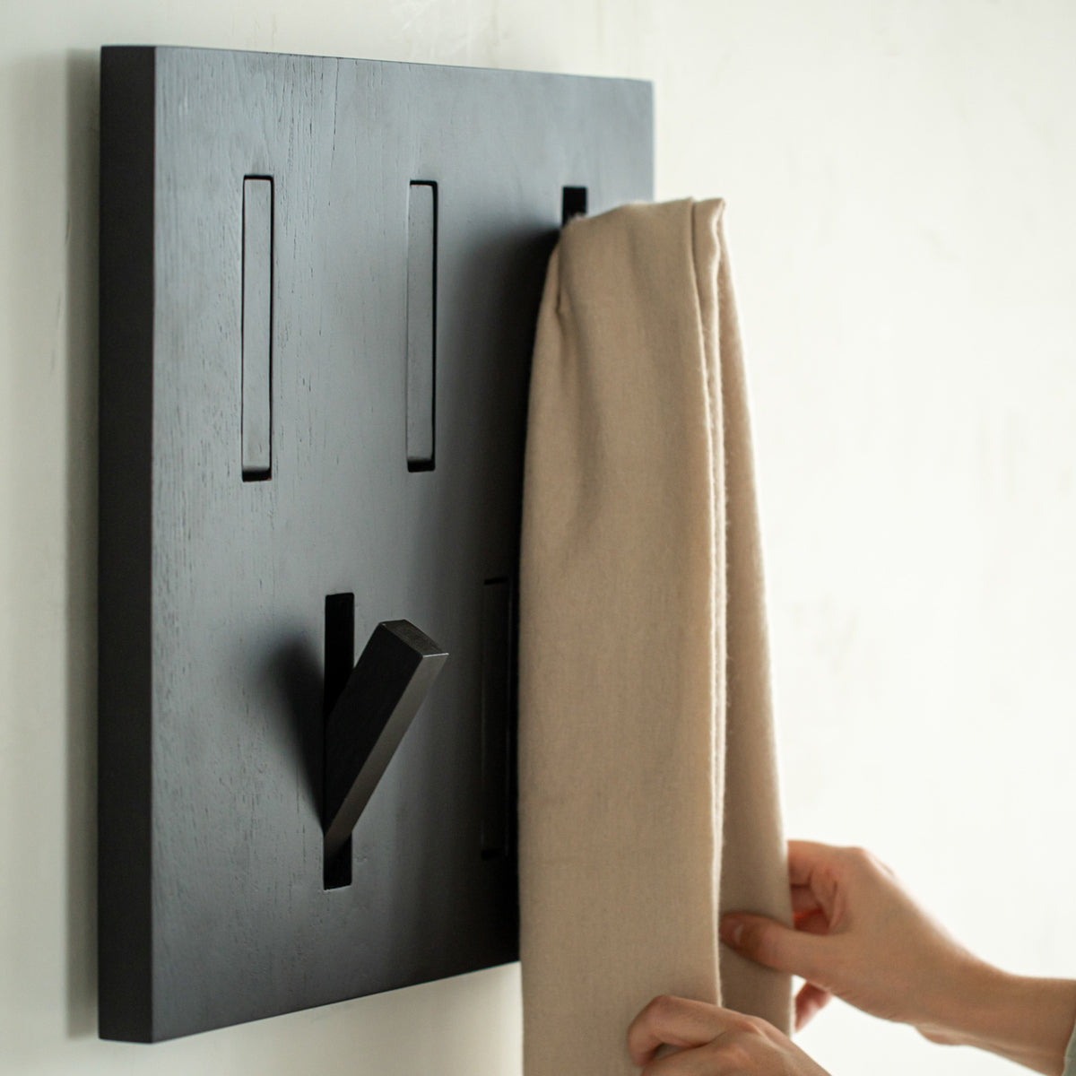 Utilitile Wall Hanger by Ethnicraft, showing utilitile wall hanger in live shot.