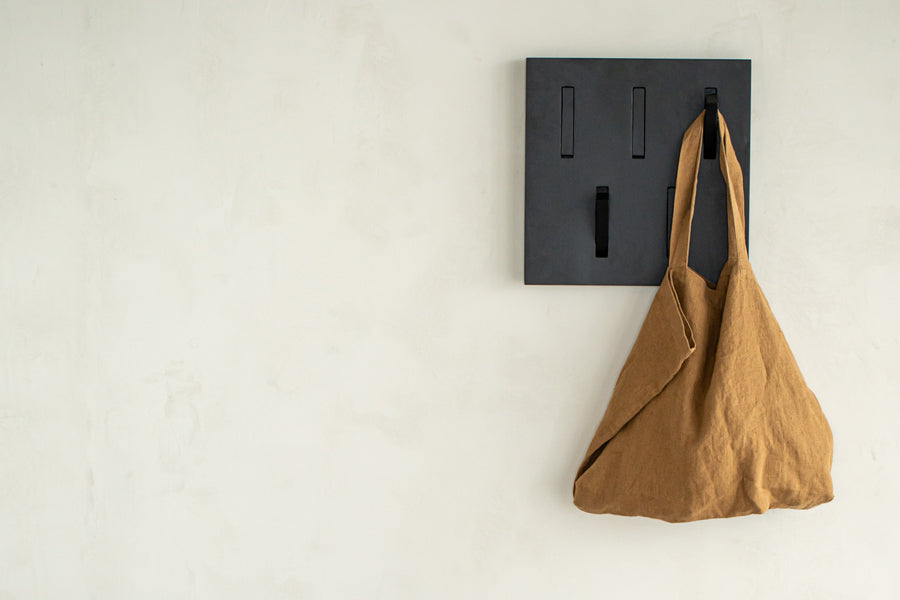 Utilitile Wall Hanger by Ethnicraft, showing utilitile wall hanger in live shot.