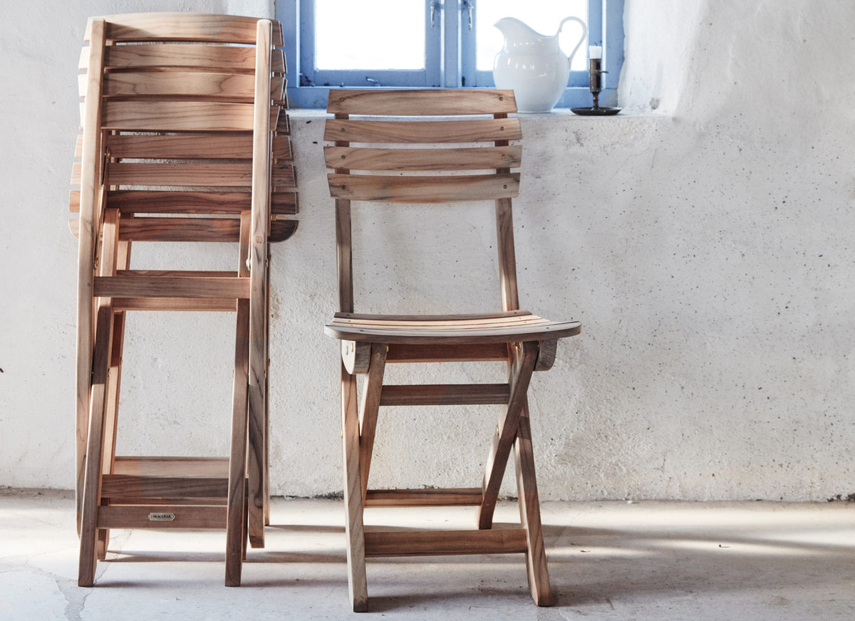 Vendia Chair by Skagerak, showing vendia chairs in live shot.