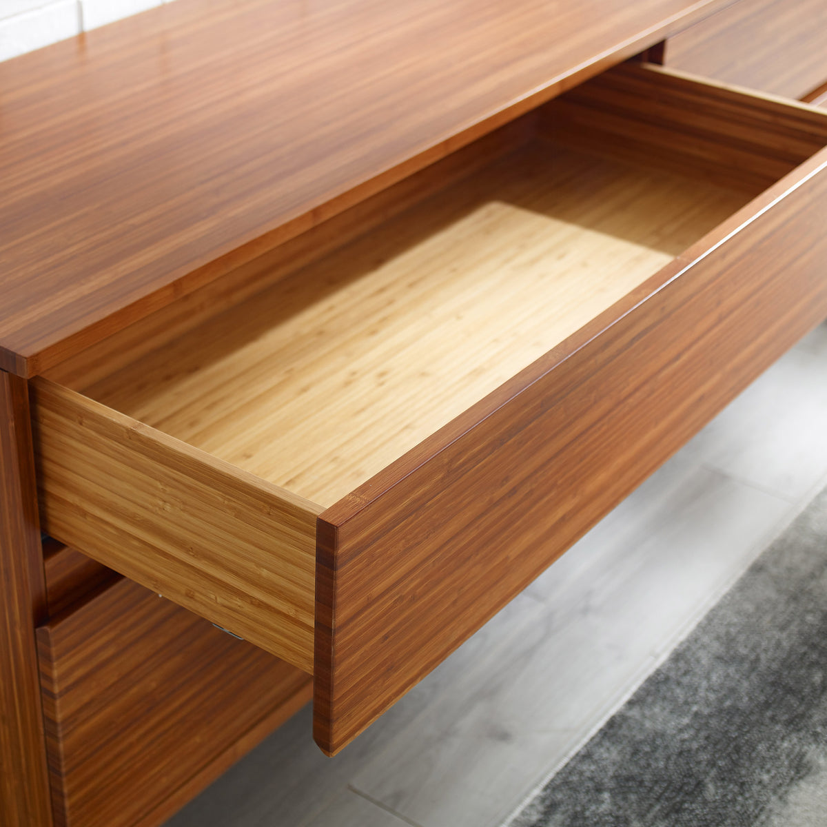 Ventura Amber 4 Drawer Double Dresser by Greenington, showing closeup view of ventura amber 4 drawer double dresser in live shot.