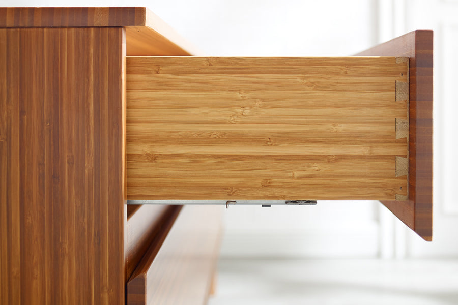 Ventura Amber 4 Drawer Double Dresser by Greenington, showing closeup view of ventura amber 4 drawer double dresser in live shot.