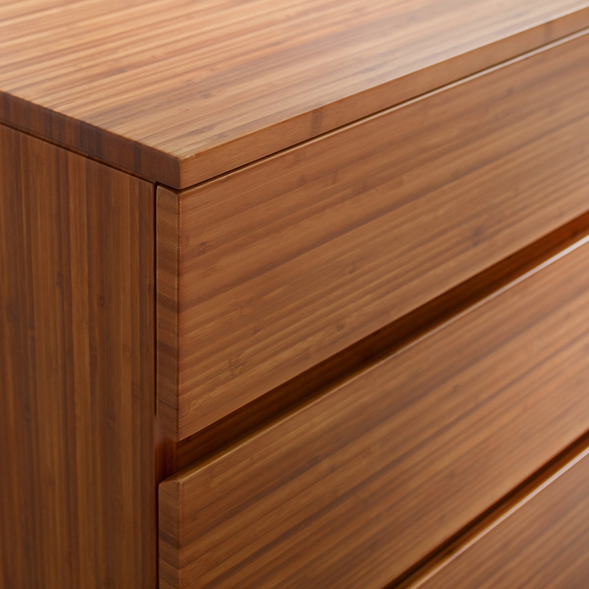 Ventura Amber 4 Drawer High Chest by Greenington, showing closeup view of ventura amber 4 drawer high chest in live shot.