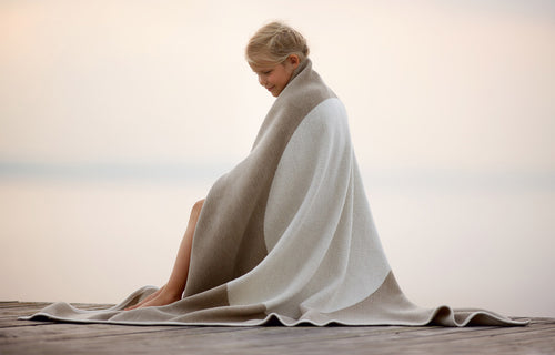 Vera Blanket by Pappelina, showing vera nougat blanket in live shot.