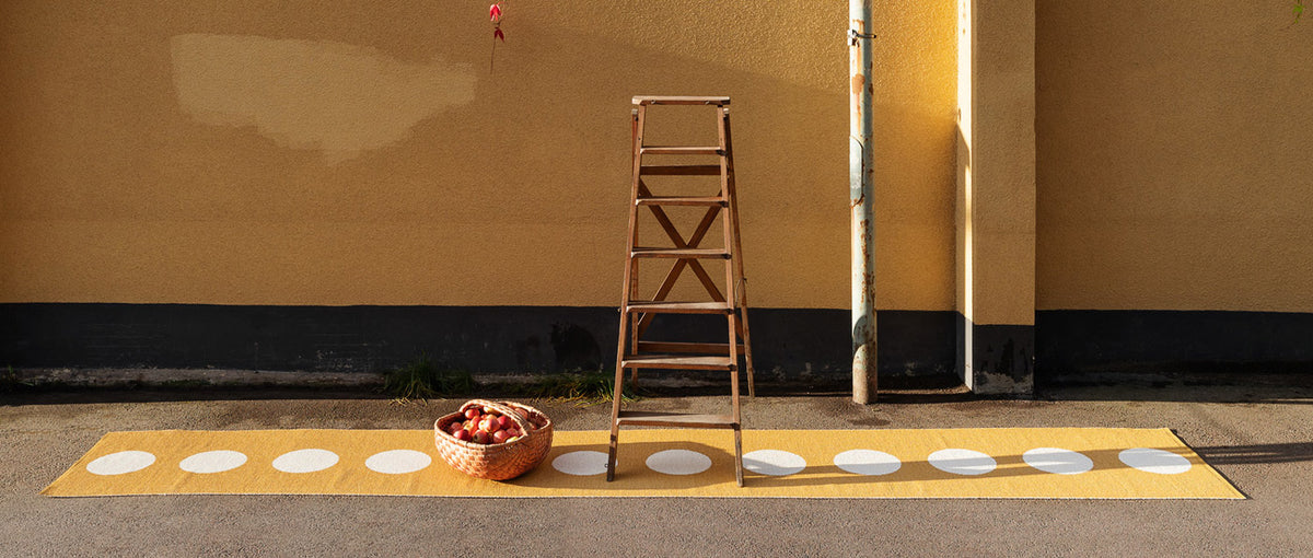 Vera Ochre & Vanilla Runner Rug by Pappelina, showing of vera ochre & vanilla runner rug in live shot.