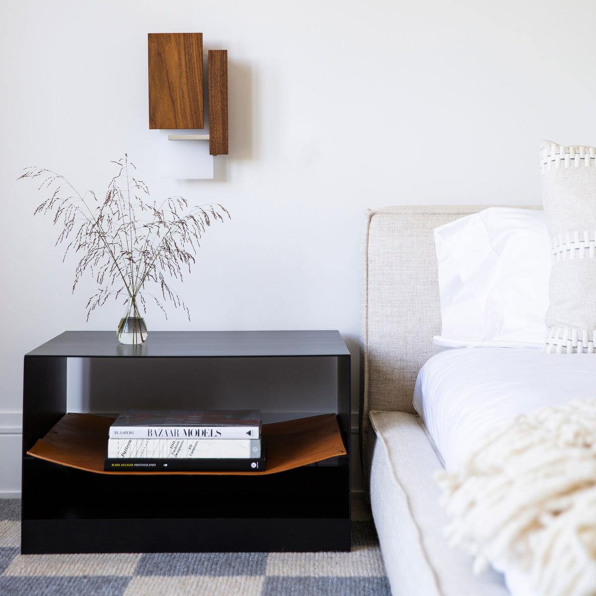 Vesper LED Sconce by Cerno, showing vesper led sconce with bed & table in live shot.