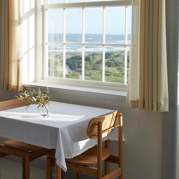 Vester Dining Chair by Skagerak, showing vester dining chairs in live shot.
