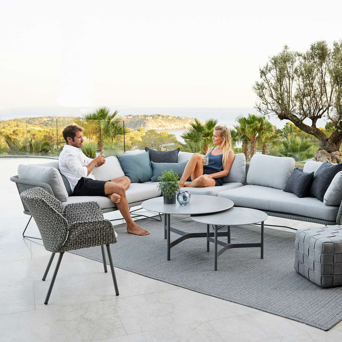 Vibe Outdoor Lounge Chair by Cane-Line, showing vibe outdoor lounge chair in live shot.
