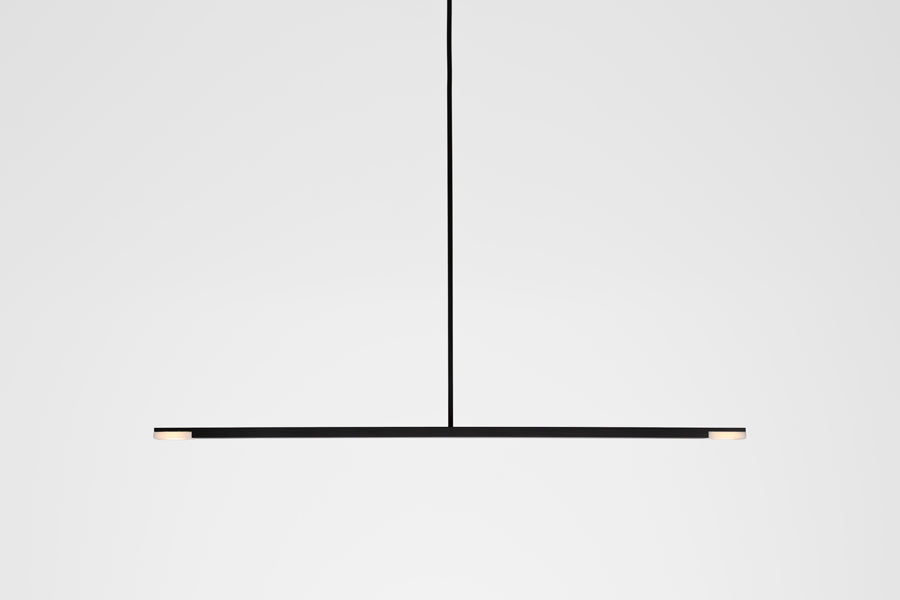 Virga LED Linear Pendant by Cerno, showing front view of virga black anodized led linear pendant in live shot.
