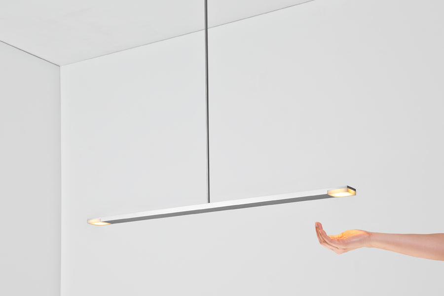 Virga LED Linear Pendant by Cerno, showing virga brushed aluminum led linear pendant in live shot.