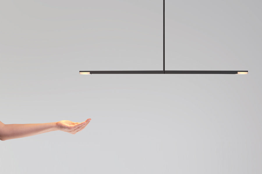 Virga LED Linear Pendant by Cerno, showing virga black anodized led linear pendant in live shot.
