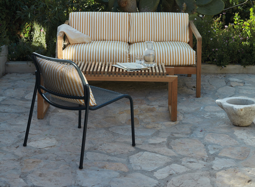 Virkelyst 2-Seater Sofa by Skagerak, showing virkelyst sofa with chair in live shot.