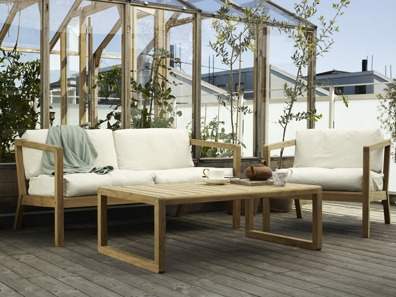 Virkelyst 2-Seater Sofa by Skagerak, showing virkelyst sofa with chair & coffee table in live shot.