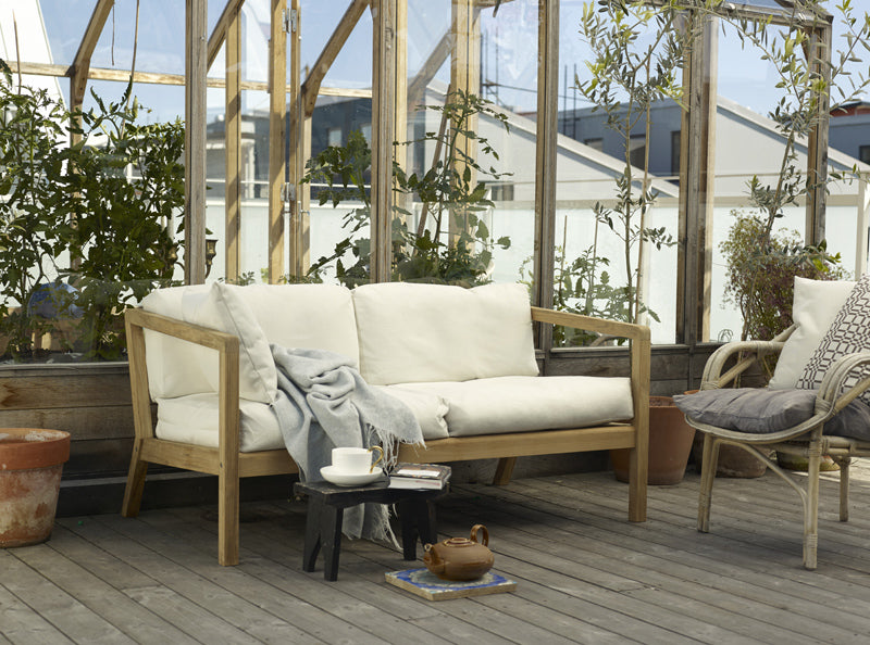 Virkelyst 2-Seater Sofa by Skagerak, showing virkelyst sofa with chair in live shot.